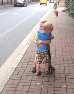 Asher and Jackson hug
